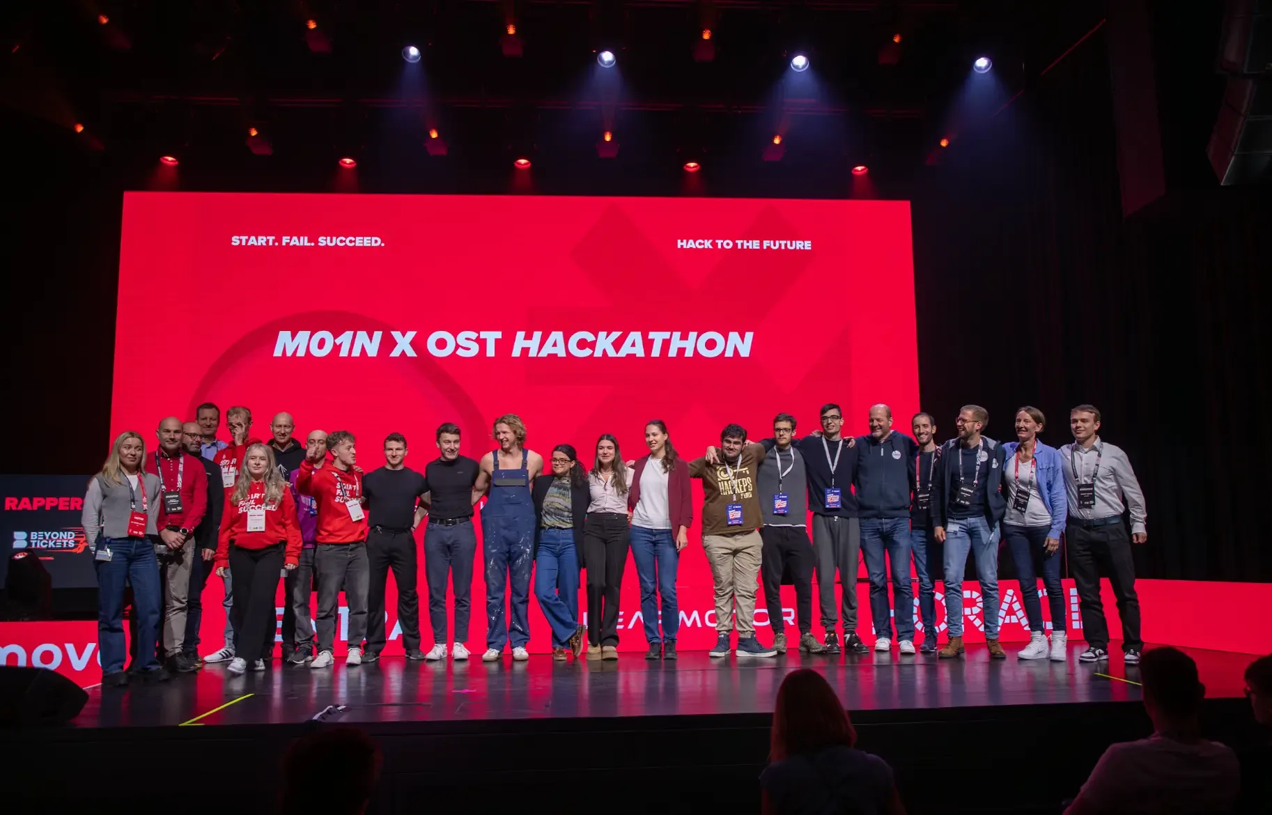 M01N x OST Hackathon teams presenting their work before the audience